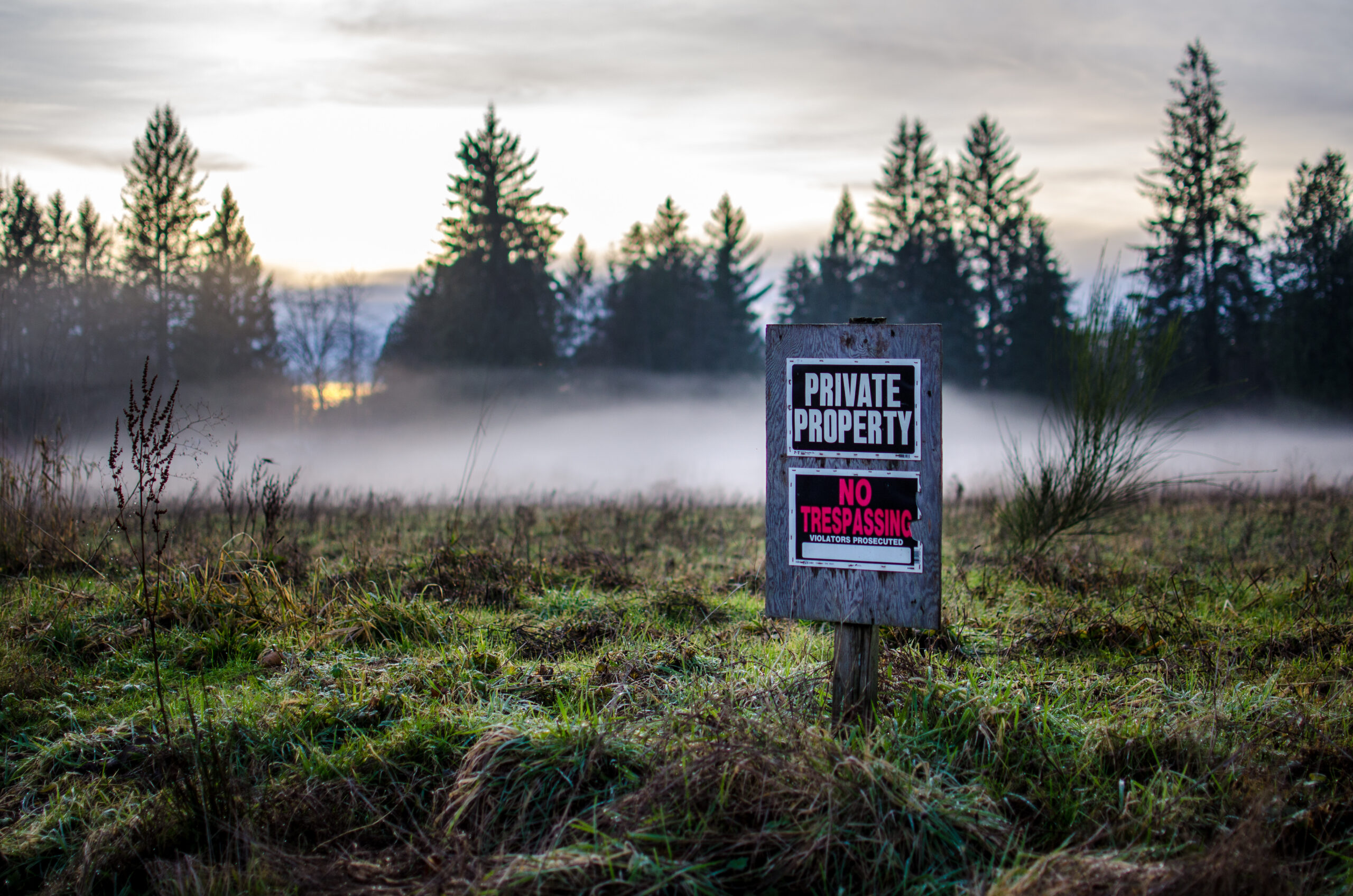 No Trespassing Private Property sign posted on rural land